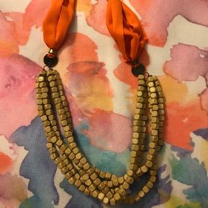 Necklace with wooden beads and cloth